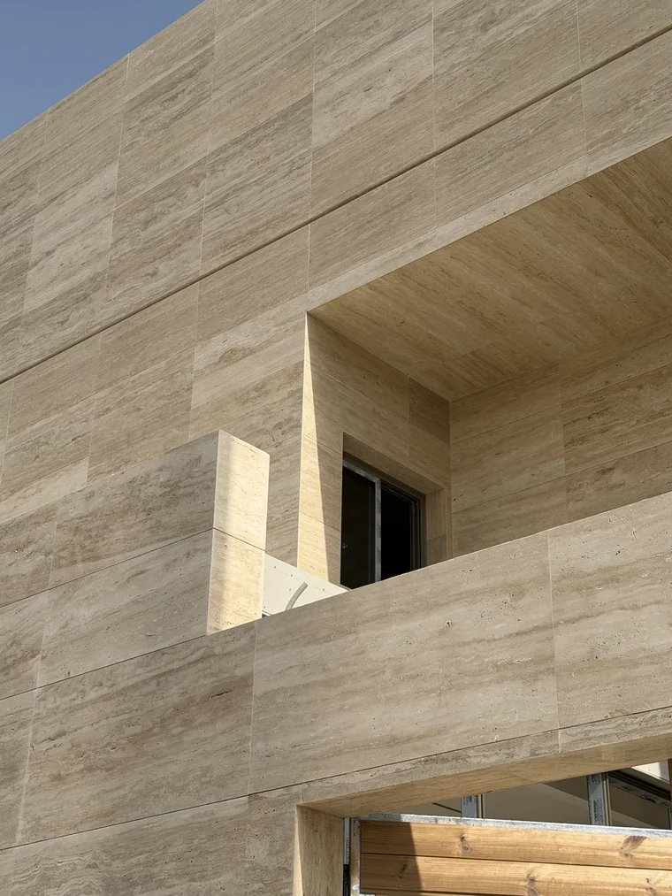 Villa Louve under construction — stone balcony and recessed opening